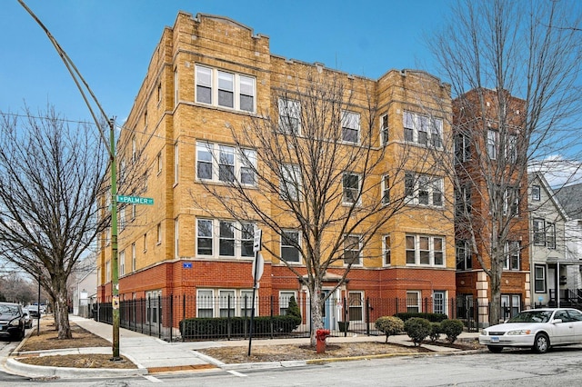 view of building exterior featuring fence