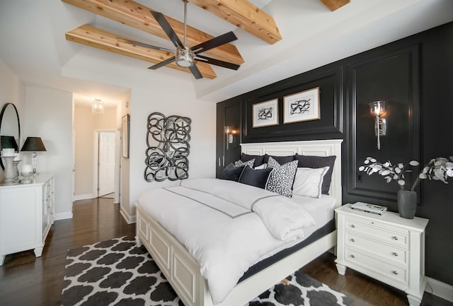 bedroom featuring dark wood-type flooring and beam ceiling