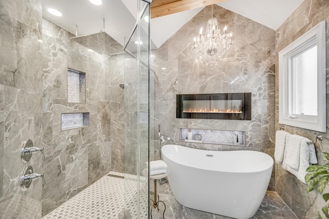 bathroom featuring tile walls, a notable chandelier, and shower with separate bathtub