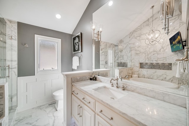 bathroom featuring vaulted ceiling, shower with separate bathtub, vanity, and a chandelier