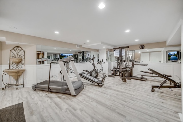 workout area with light wood-type flooring