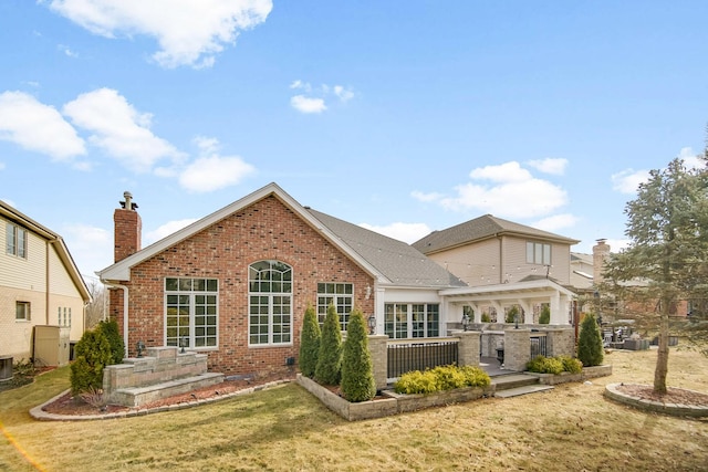 back of property with cooling unit and a yard