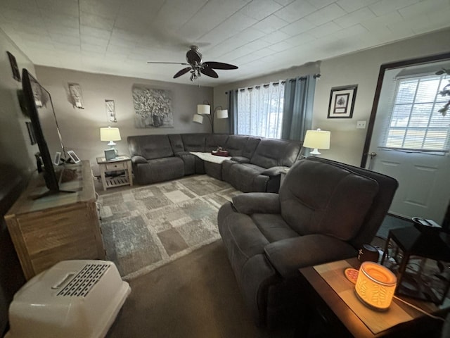 living room featuring carpet flooring and ceiling fan