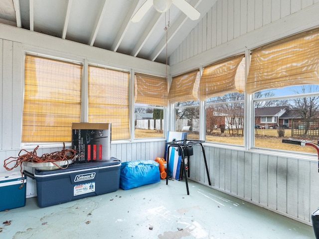 sunroom / solarium featuring a ceiling fan and vaulted ceiling