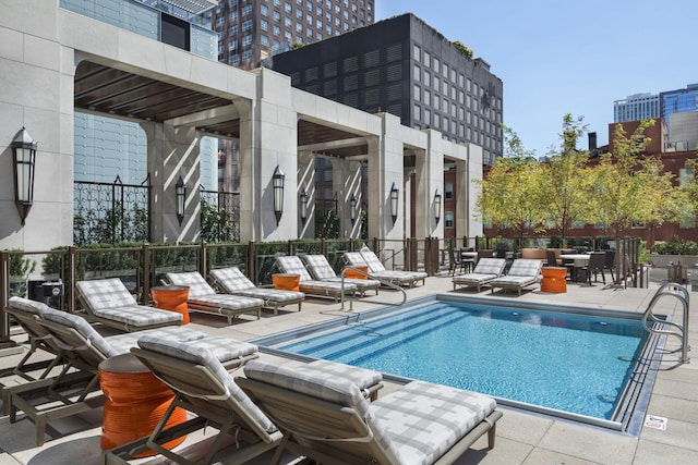 view of swimming pool featuring a patio area