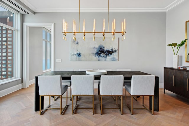 dining area featuring crown molding, a notable chandelier, and light parquet floors