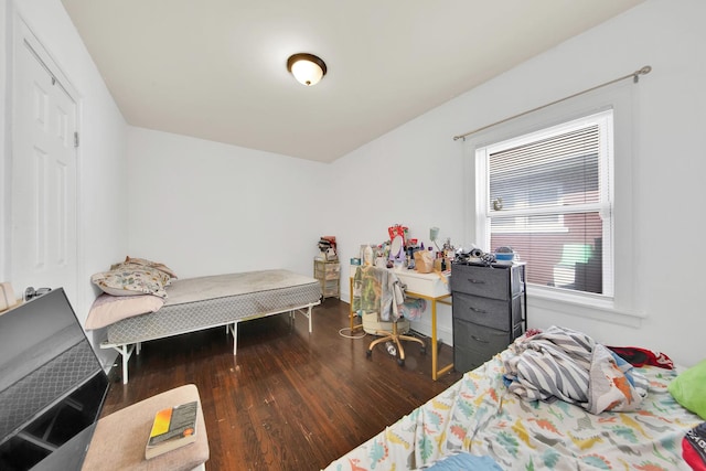 bedroom featuring wood finished floors