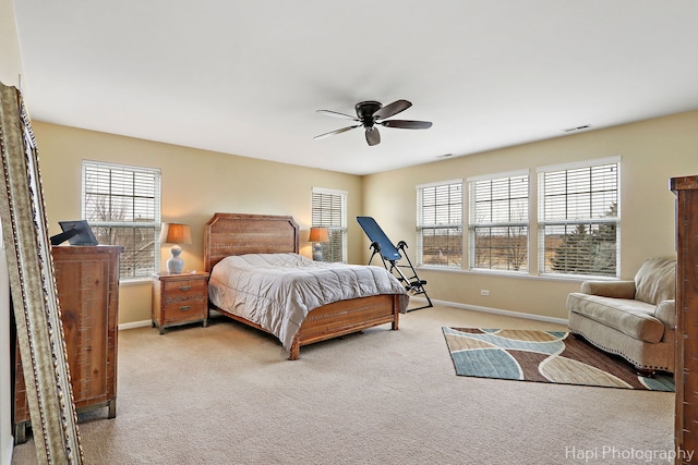 bedroom with ceiling fan and carpet flooring