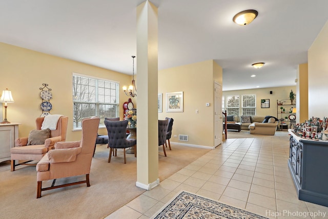 interior space featuring a chandelier and light tile patterned flooring