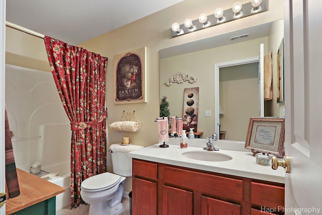 full bathroom featuring vanity, tile patterned floors, shower / bath combination with curtain, and toilet