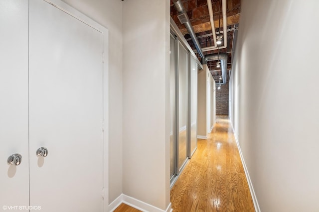 hall with light hardwood / wood-style flooring