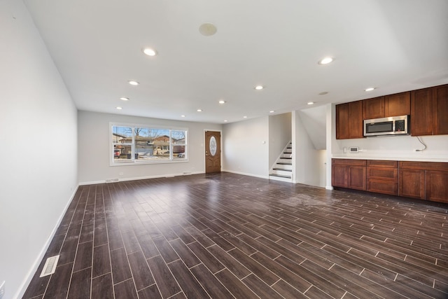 unfurnished living room with dark hardwood / wood-style flooring