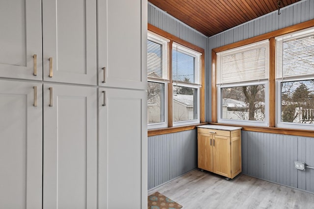 unfurnished sunroom featuring wooden ceiling