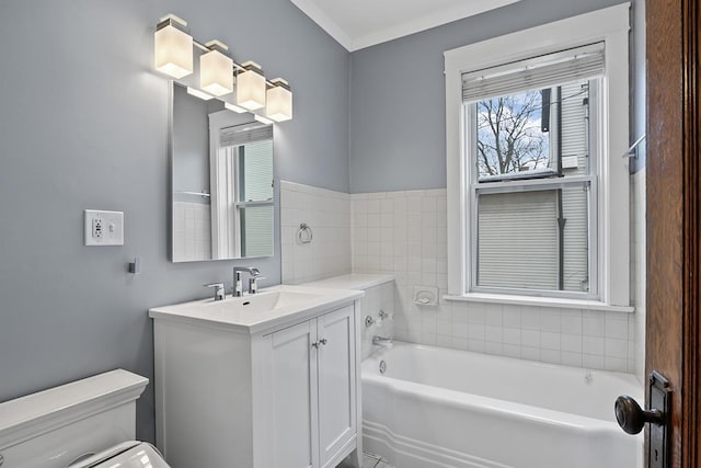 bathroom featuring vanity, toilet, and a bathing tub