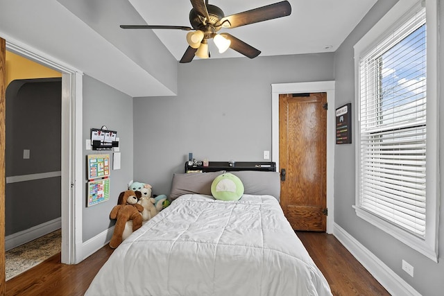 bedroom with dark wood-type flooring and ceiling fan