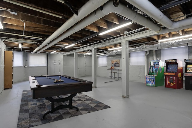 rec room with billiards and concrete flooring