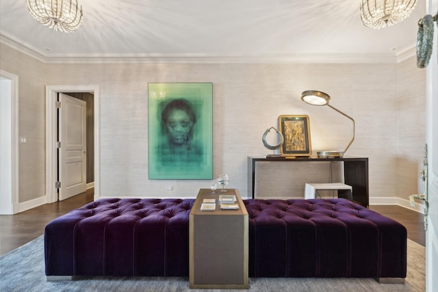 living room with ornamental molding, an inviting chandelier, wood finished floors, and baseboards