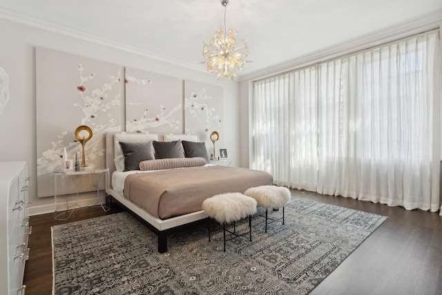 bedroom featuring dark wood-style floors, multiple windows, crown molding, and an inviting chandelier