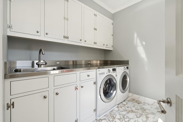 laundry area with marble finish floor, cabinet space, ornamental molding, washing machine and dryer, and a sink