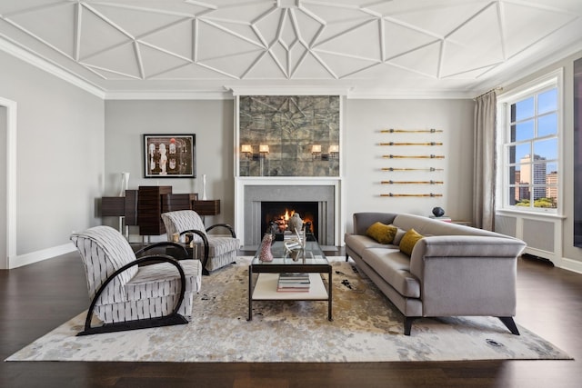 living area featuring a fireplace, ornamental molding, and coffered ceiling