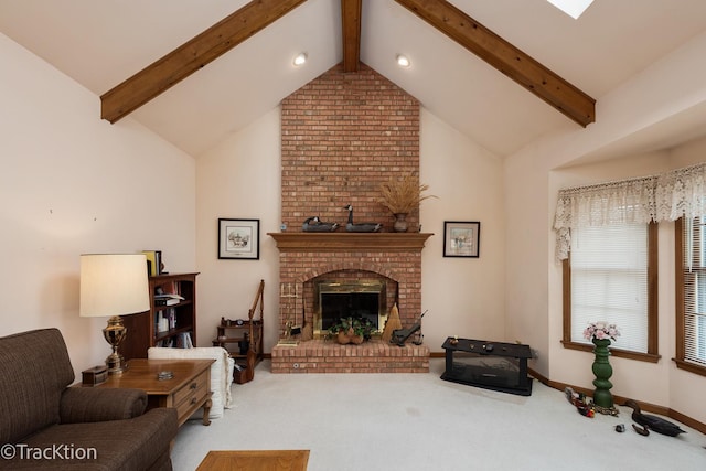 living room with vaulted ceiling with beams, a fireplace, and carpet flooring