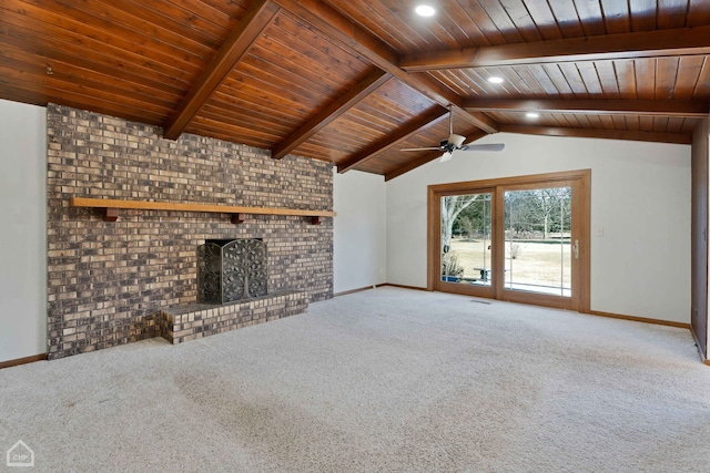 unfurnished living room featuring vaulted ceiling with beams, carpet floors, wooden ceiling, and a brick fireplace