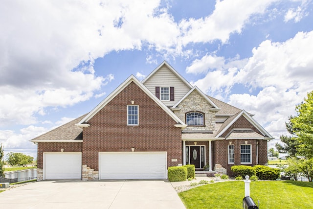 view of front of property with a garage and a front lawn