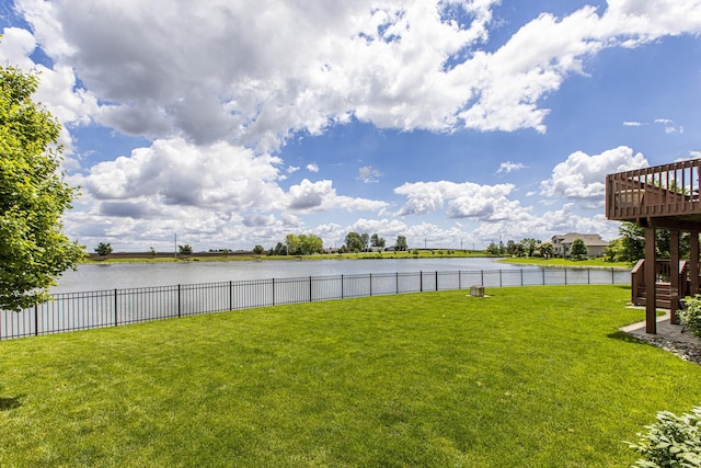 view of yard featuring a deck with water view