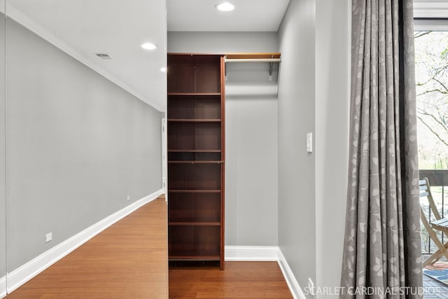 714 Walnut Dr Unit 109, Darien, IL 60561 - walk in closet with wood finished floors and visible vents