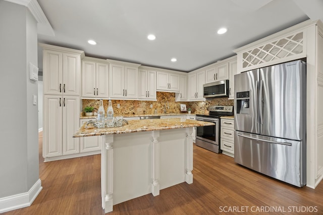 714 Walnut Dr Unit 109, Darien, IL 60561 - kitchen with appliances with stainless steel finishes, wood finished floors, and tasteful backsplash