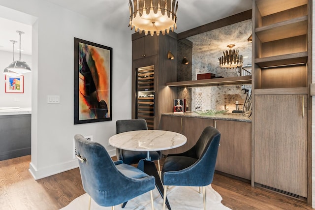 dining area featuring baseboards and wood finished floors