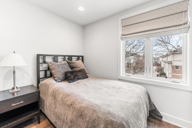 bedroom featuring recessed lighting, baseboards, and wood finished floors