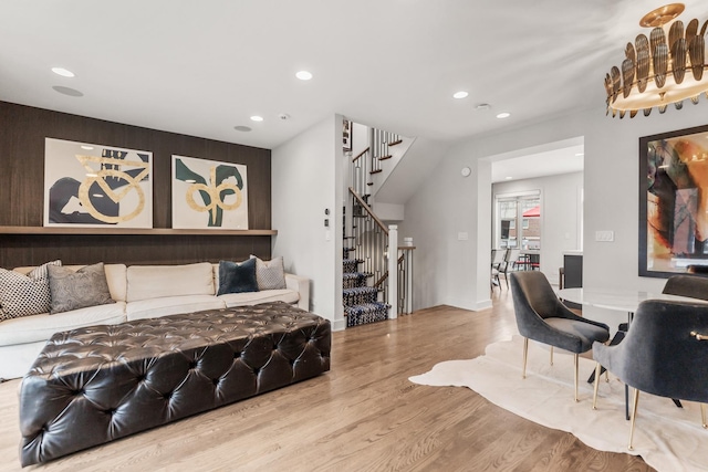 bedroom featuring baseboards, wood finished floors, and recessed lighting