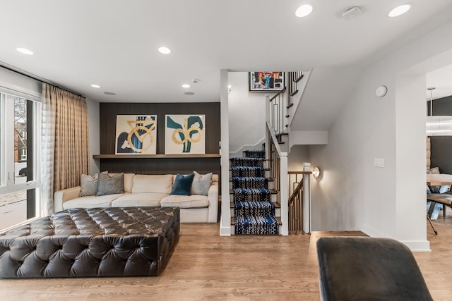 interior space featuring recessed lighting, baseboards, and wood finished floors