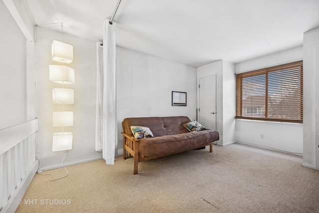 sitting room with light carpet and baseboards