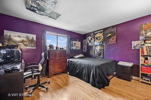 bedroom with wood finished floors