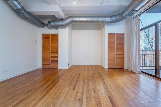 basement featuring light hardwood / wood-style floors