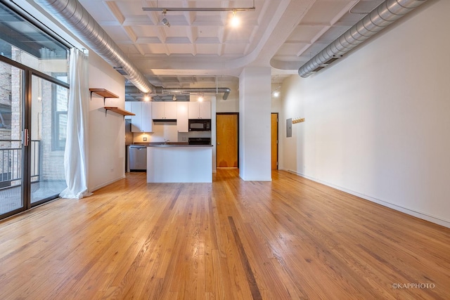 unfurnished living room featuring light hardwood / wood-style flooring