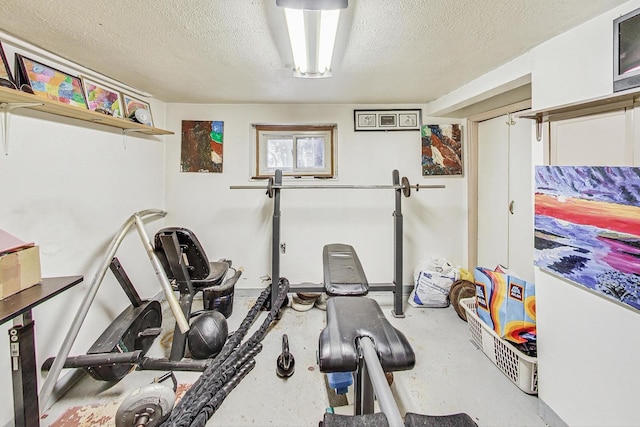 workout area featuring a textured ceiling