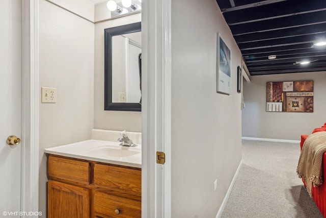 bathroom featuring vanity and baseboards