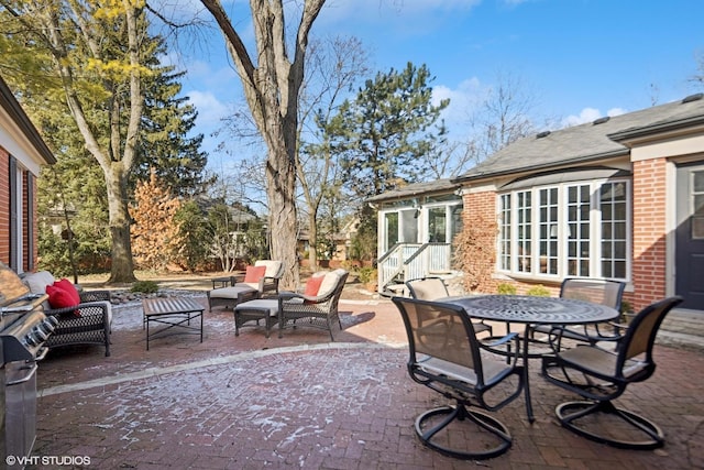 view of patio featuring french doors, outdoor dining area, and an outdoor hangout area