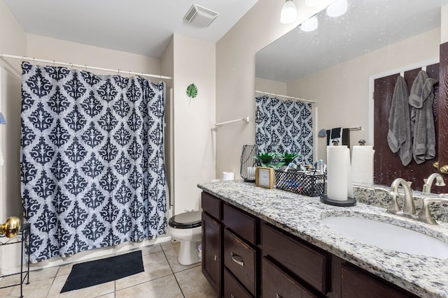 full bath with tile patterned flooring, toilet, vanity, visible vents, and a shower with curtain