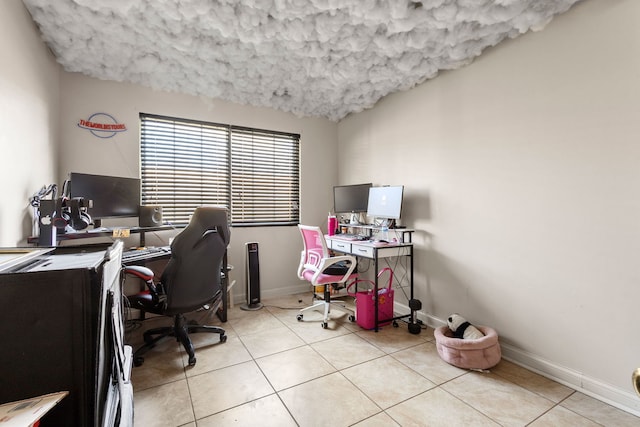 office featuring light tile patterned floors and baseboards