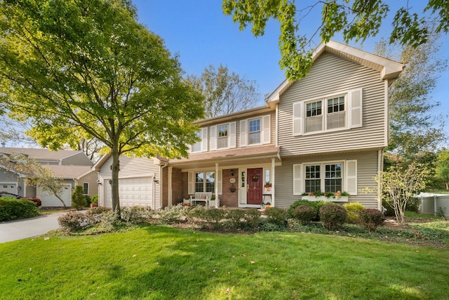 front facade featuring a porch, a garage, and a front yard