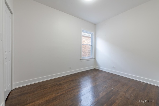 unfurnished room featuring dark hardwood / wood-style floors