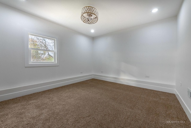 spare room featuring carpet floors