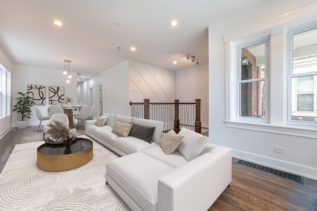 living room featuring dark hardwood / wood-style flooring