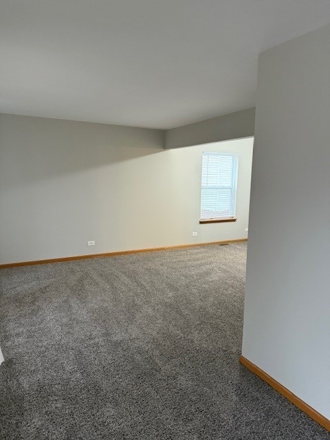 unfurnished room with carpet flooring