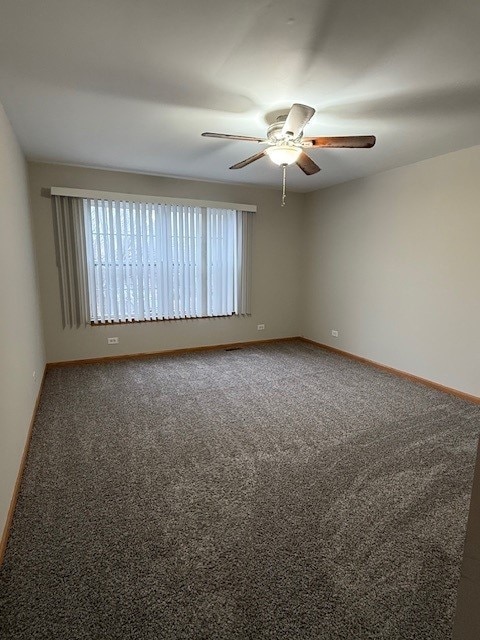 unfurnished room with carpet floors and ceiling fan