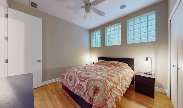 bedroom featuring ceiling fan and light hardwood / wood-style flooring